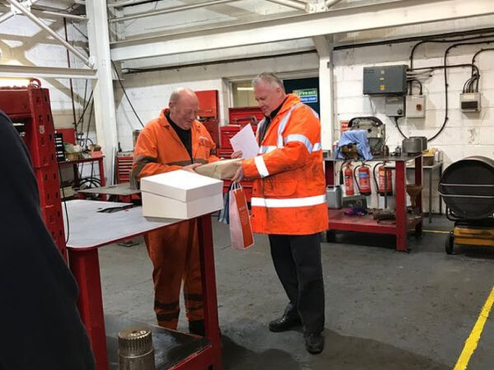 EP Industries team members reviewing paperwork in the workshop