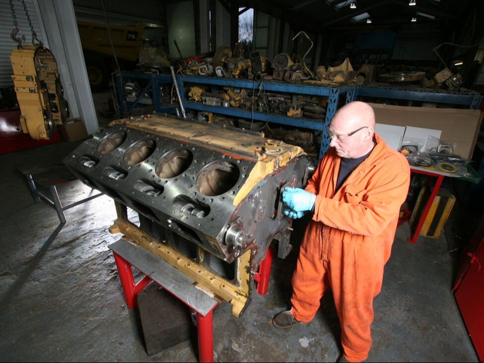EP Industries engineer working on a mobile plant engine in the workshop